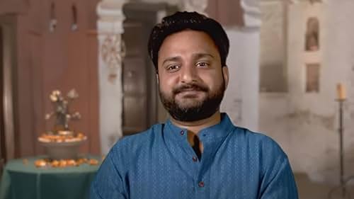 Sumit Singh as a participant smiling in TLC's 90 Day Fiance series.